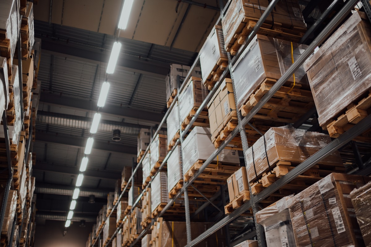Zoho ERP for Knitwear & Apparel in Tiruppur 20 knitwear ERP Tiruppur knitwear ERP Tiruppur High-bay bonded warehouse racking filled with packed export garment cartons